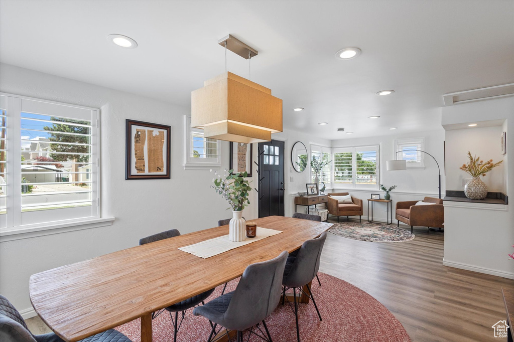 Dining space with recessed lighting and wood finished floors
