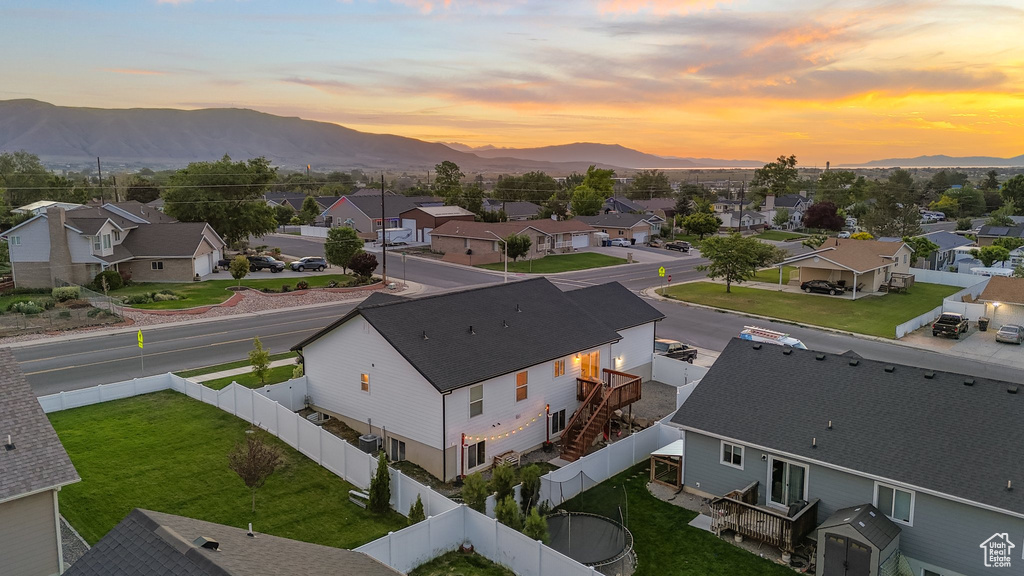 Aerial view at dusk of a residential view and a mountain view
