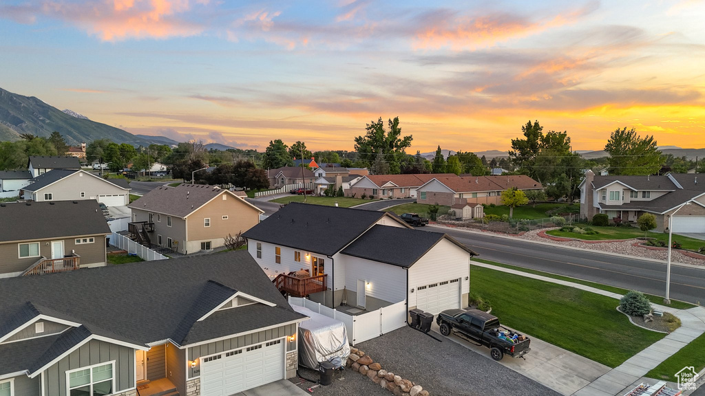 Aerial perspective of suburban area featuring a mountain backdrop