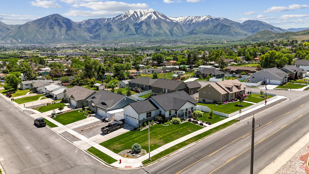 Aerial view of residential area featuring a mountain backdrop
