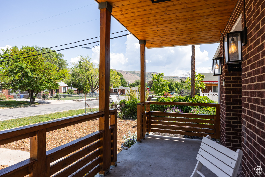 View of patio / terrace featuring a mountain view and a residential view