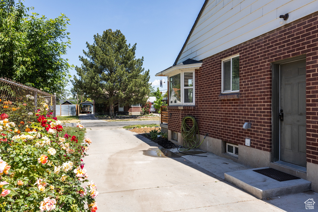 View of property exterior featuring brick siding