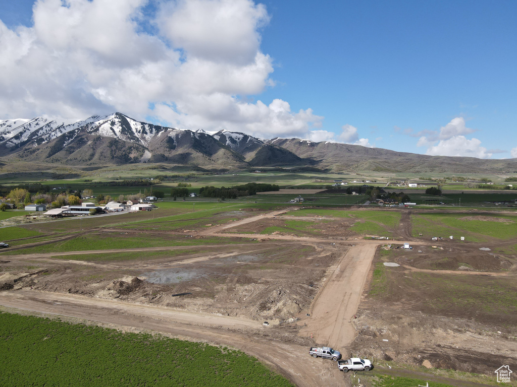 View of mountain backdrop with rural landscape