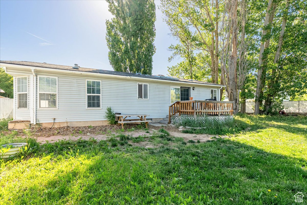 Back of house featuring a deck