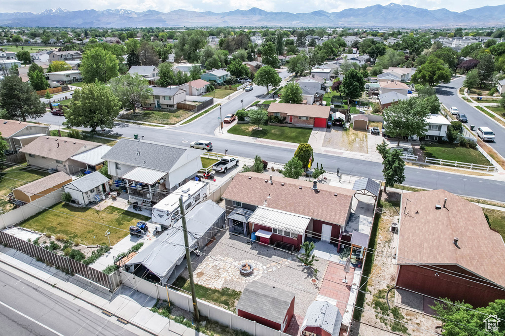 Aerial perspective of suburban area with a mountain backdrop