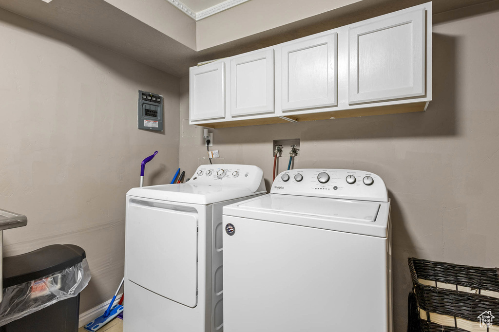 Laundry room with cabinet space and separate washer and dryer