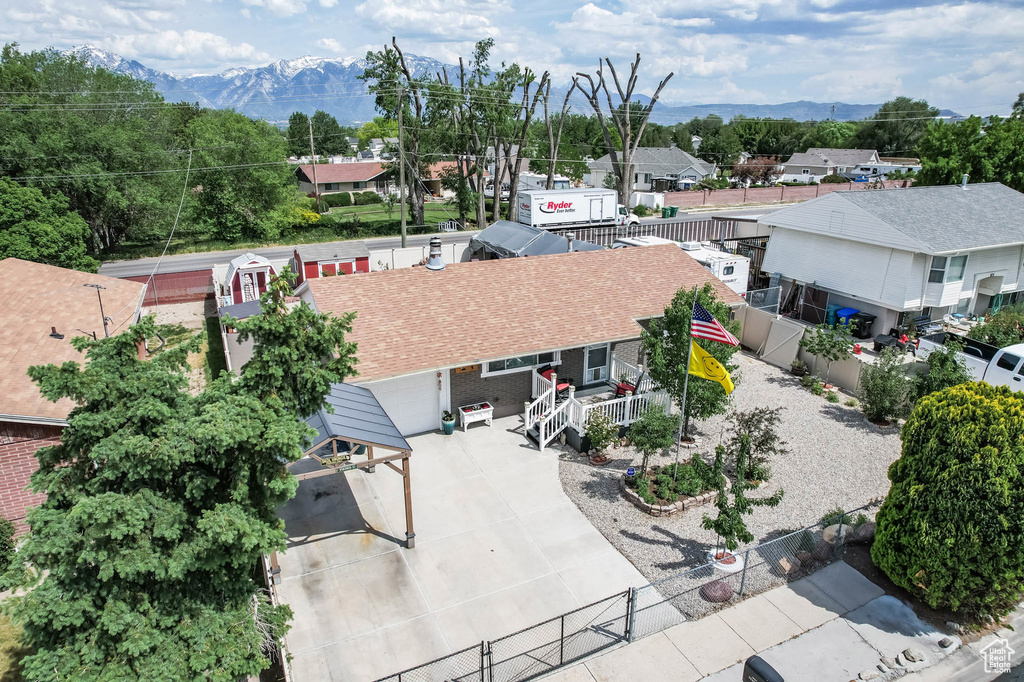 Aerial view of residential area featuring a mountainous background