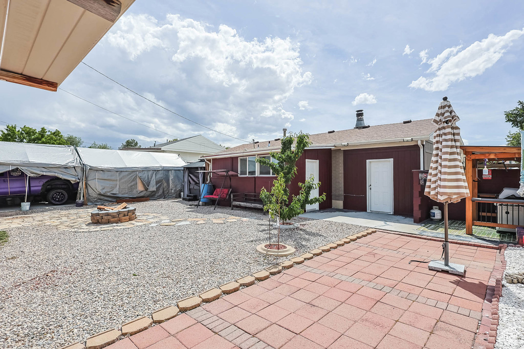 View of patio / terrace with an outdoor fire pit