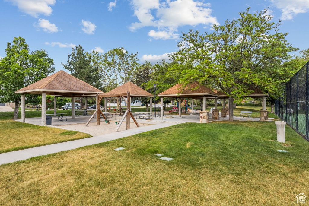 View of community featuring a gazebo and a lawn