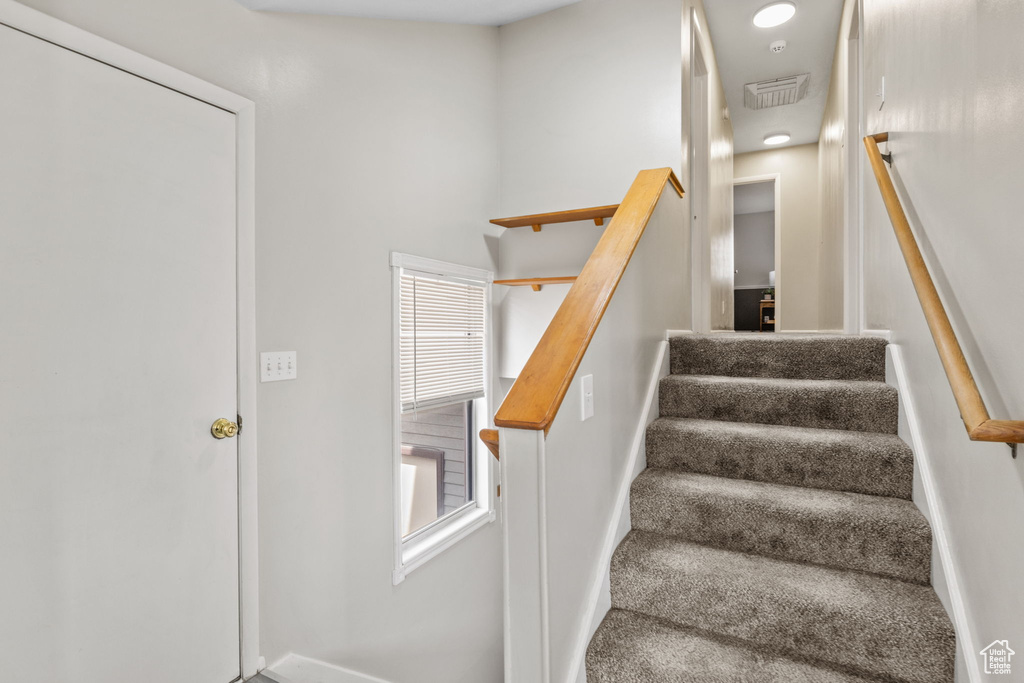 Stairway featuring baseboards