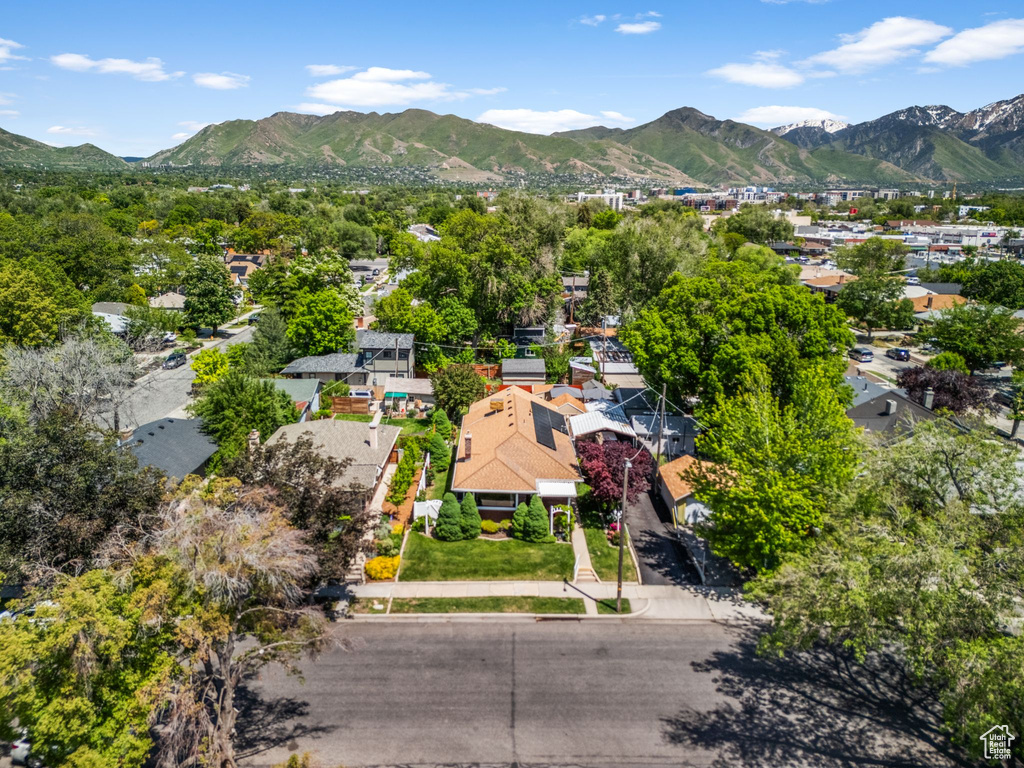 Aerial perspective of suburban area featuring a mountain backdrop