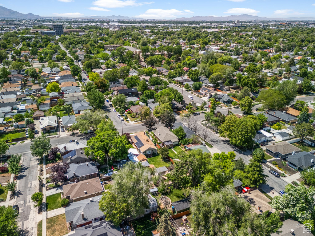 Aerial perspective of suburban area featuring a mountain backdrop