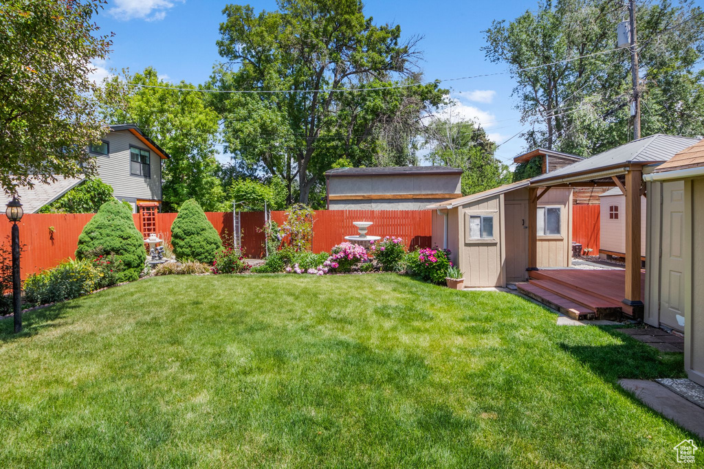 View of yard with a deck