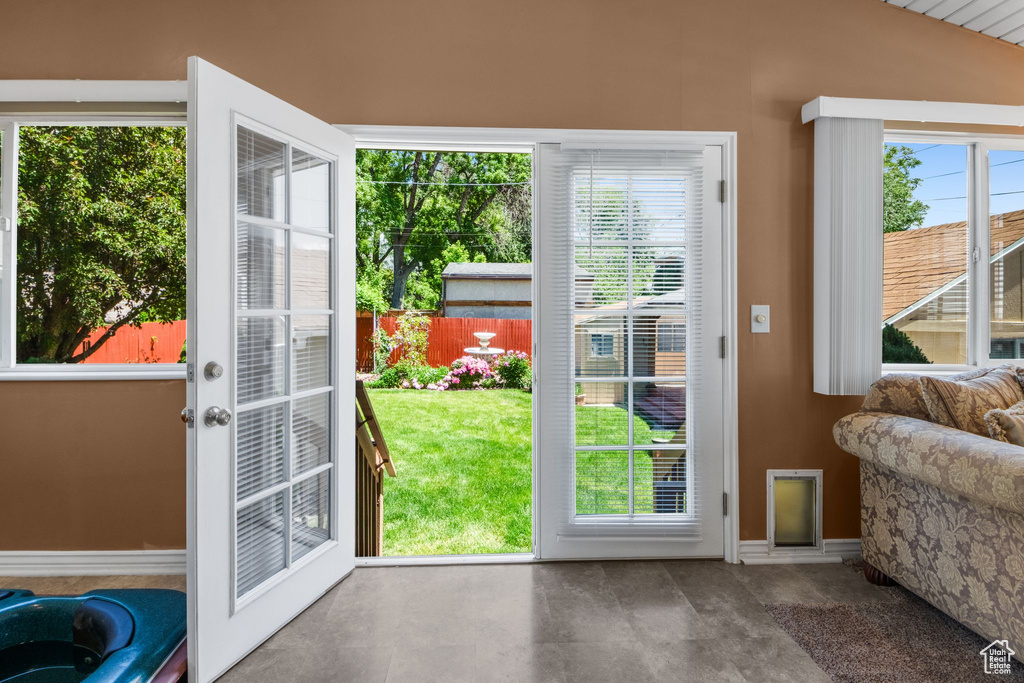 Doorway to outside with baseboards