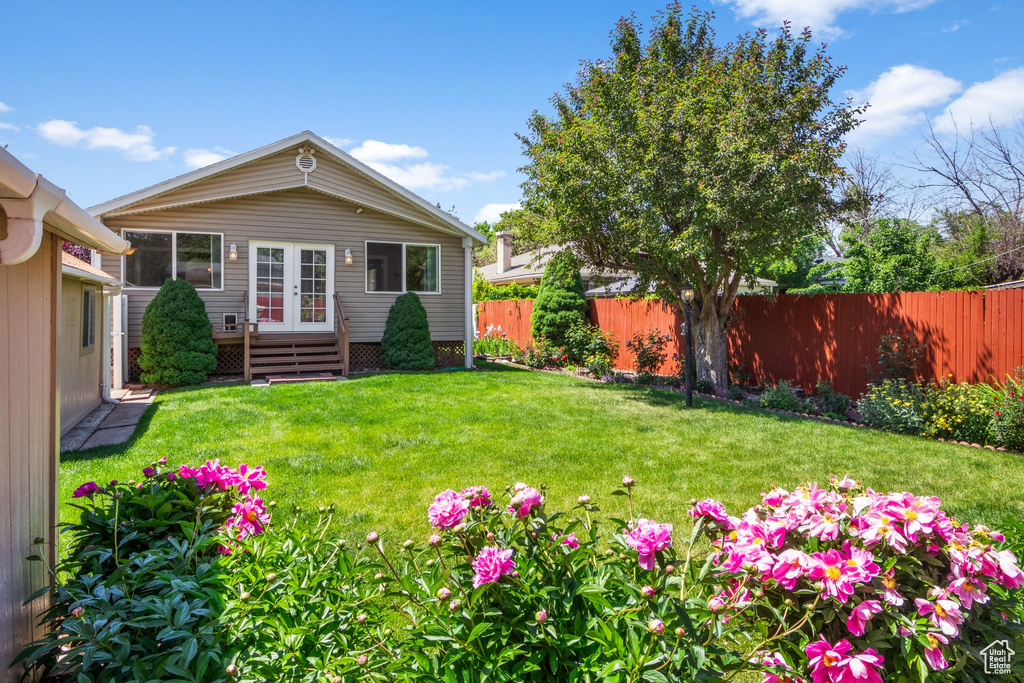View of yard with french doors