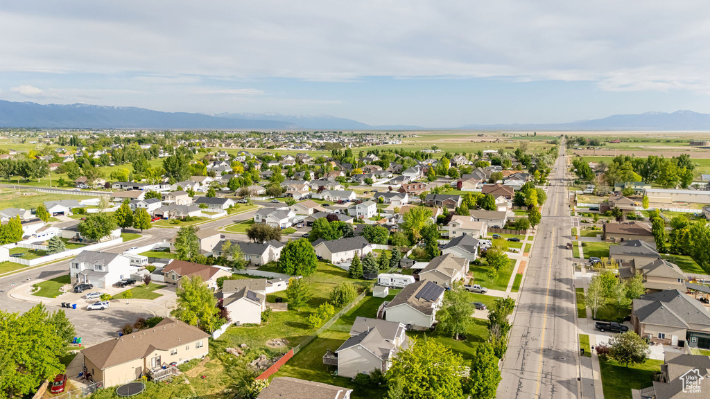Aerial view of residential area with a mountainous background