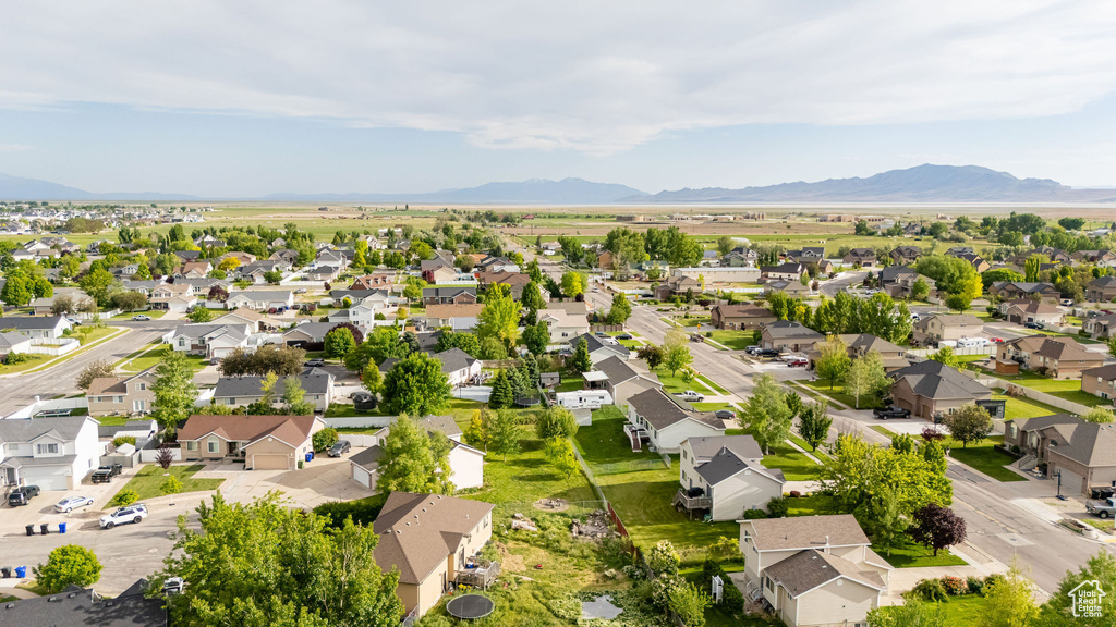 Aerial perspective of suburban area with a mountainous background