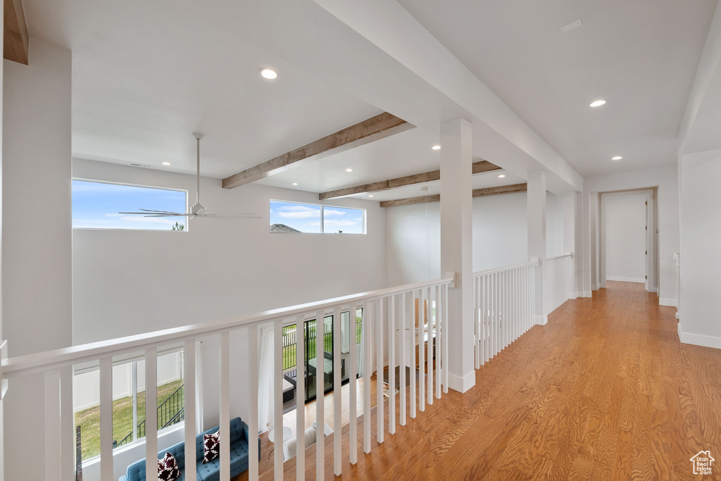 Hallway featuring recessed lighting, wood finished floors, and beamed ceiling