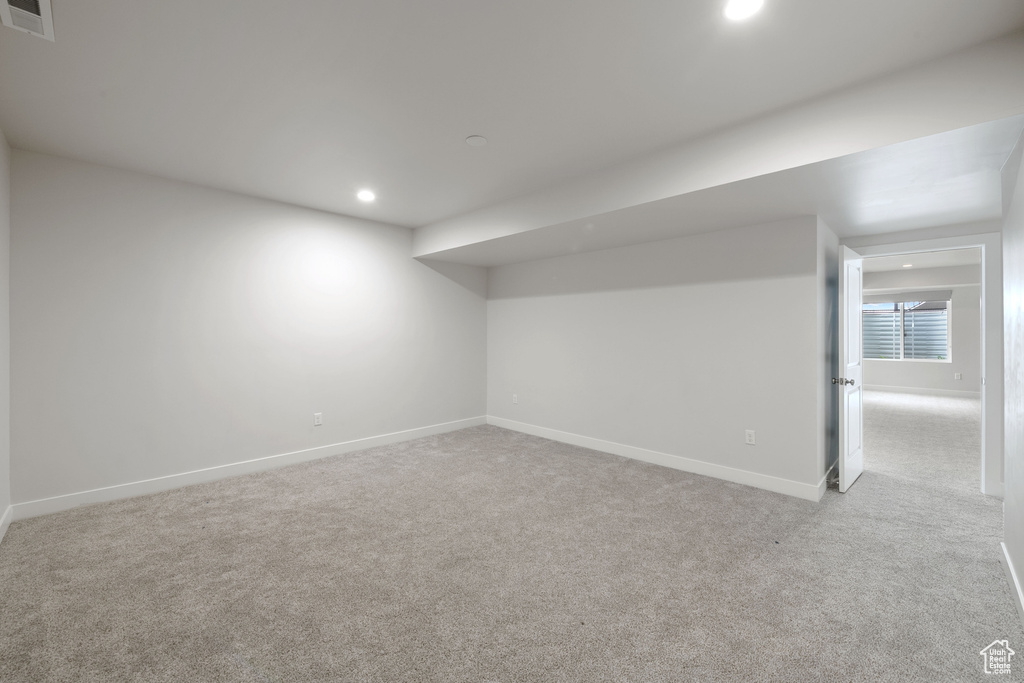 Basement with carpet, baseboards, and recessed lighting