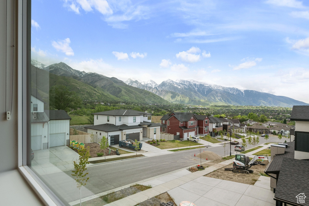 View of mountain backdrop featuring nearby suburban area