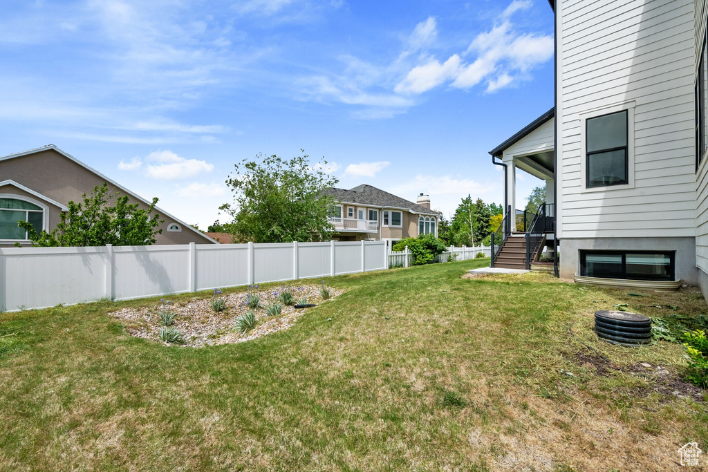 View of yard featuring stairs
