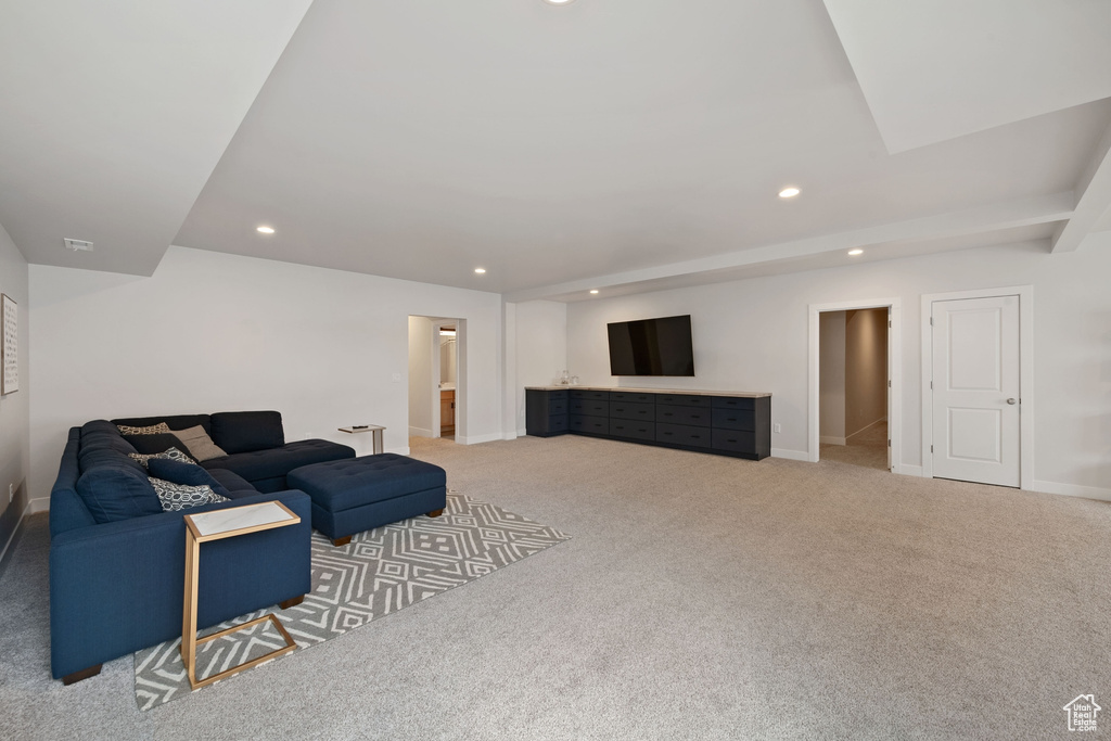 Living area with recessed lighting, carpet floors, and baseboards