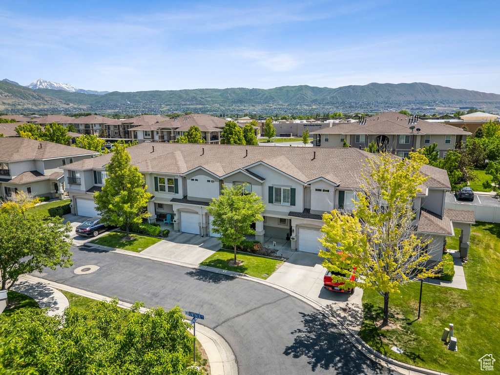 Aerial view of residential area with a mountain backdrop