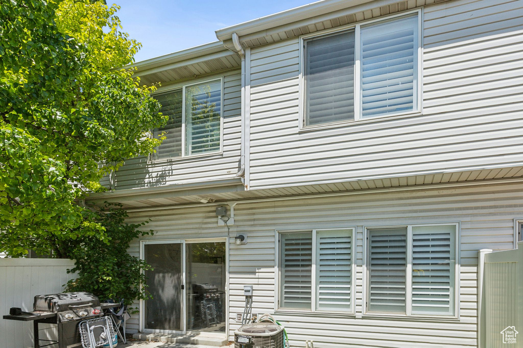 Rear view of property with central air condition unit