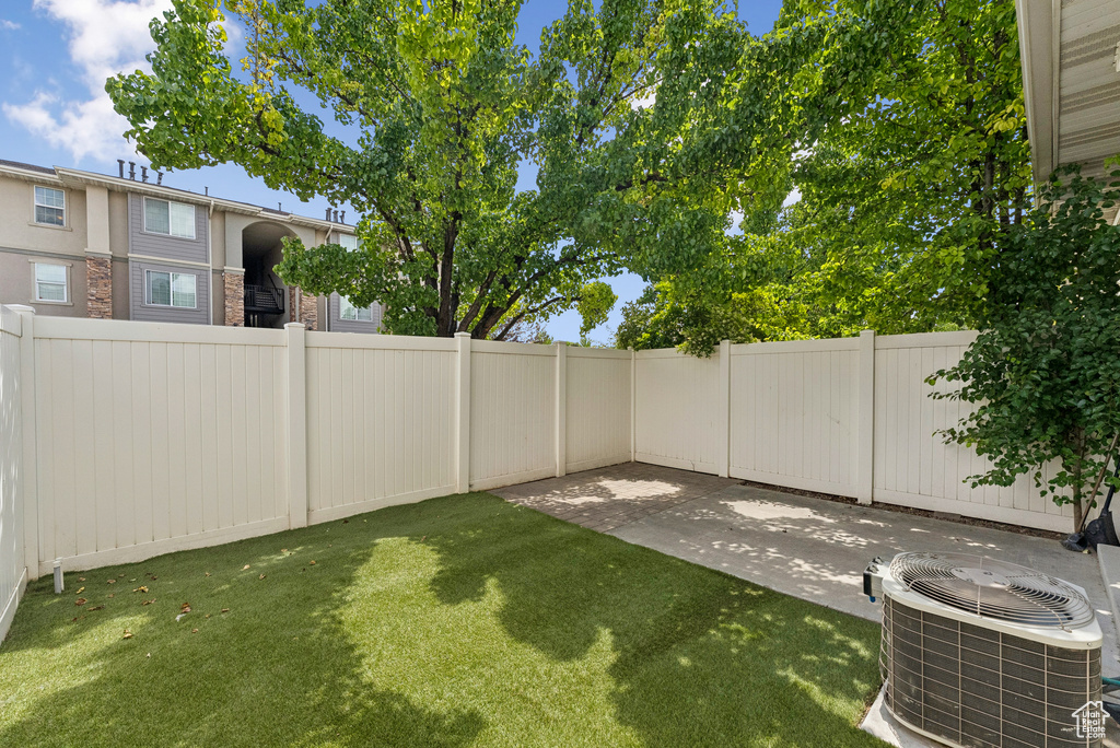 Fenced yard featuring a patio
