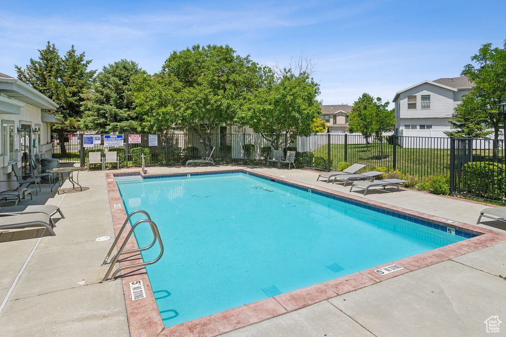 Community pool with a patio area