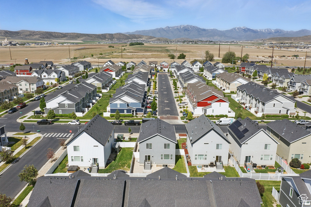 Aerial perspective of suburban area featuring a mountainous background
