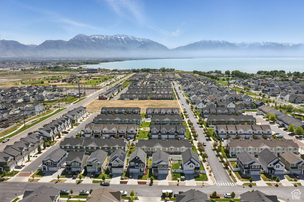 Aerial perspective of suburban area featuring a water and mountain view