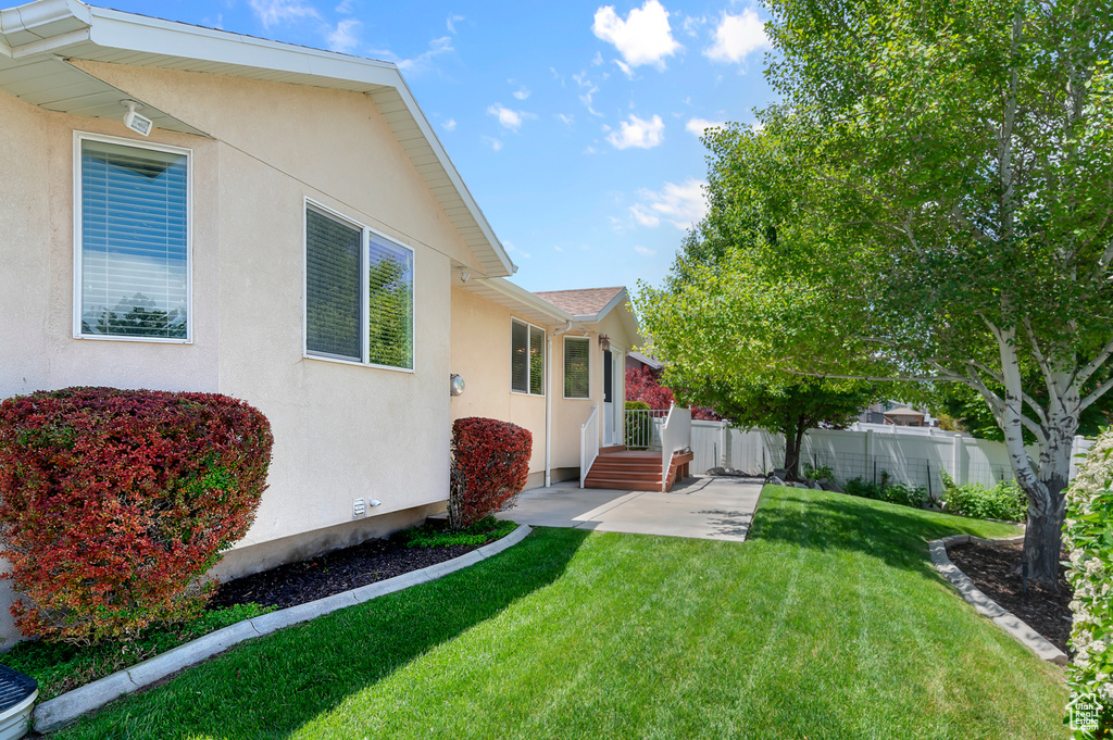 View of yard with a patio