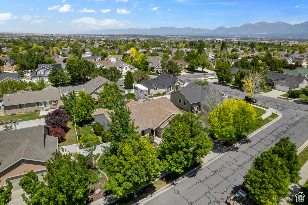 Aerial view of residential area featuring a mountain backdrop