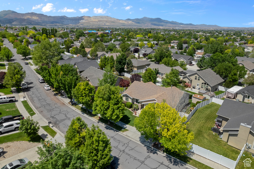 Aerial perspective of suburban area featuring a mountainous background