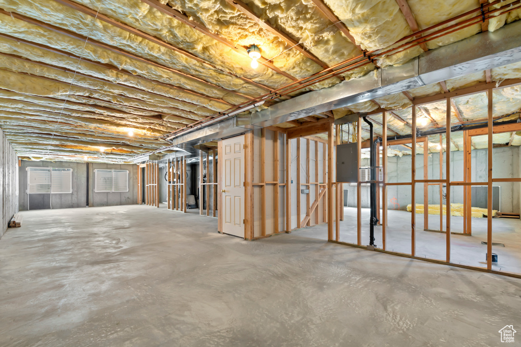 Unfinished below grade area featuring electric panel