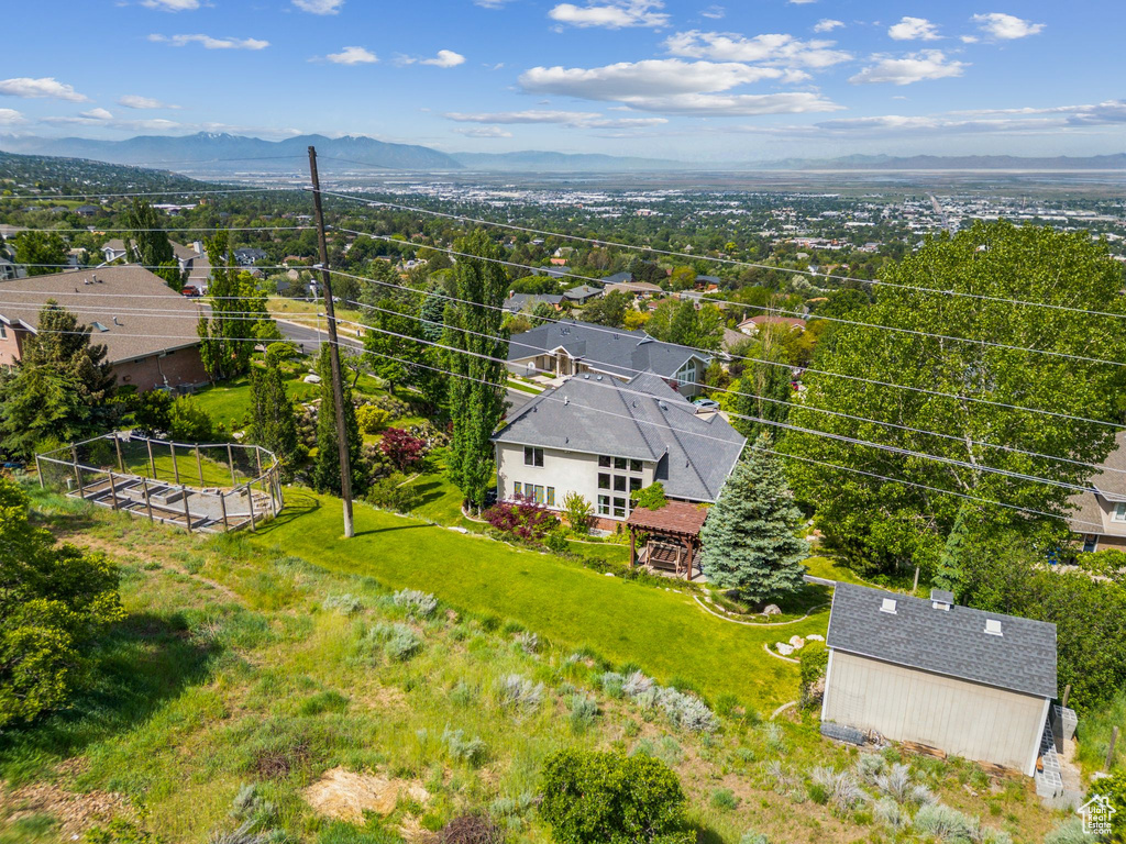 Aerial perspective of suburban area with a mountain backdrop