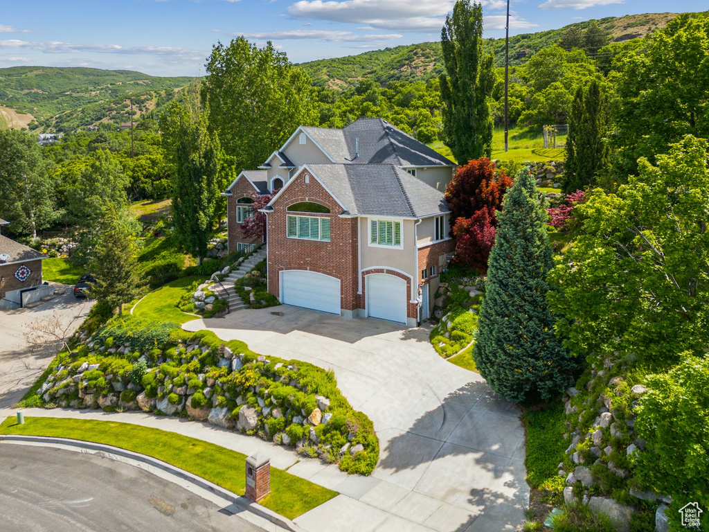 View from above of property with a heavily wooded area