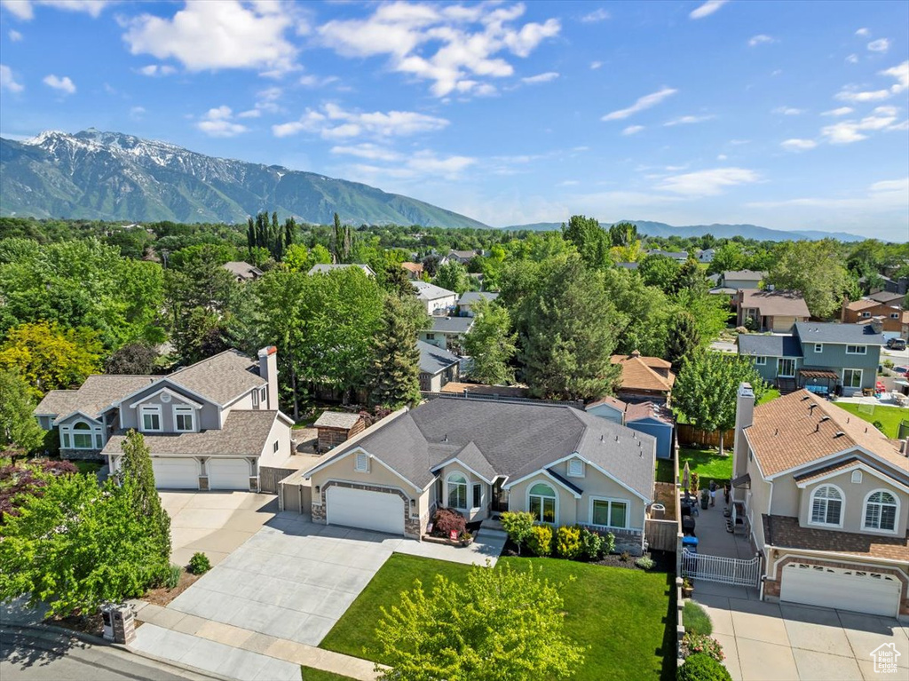 Aerial perspective of suburban area with a mountain backdrop