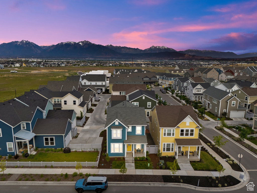 Aerial view at dusk of a residential view and a mountain view