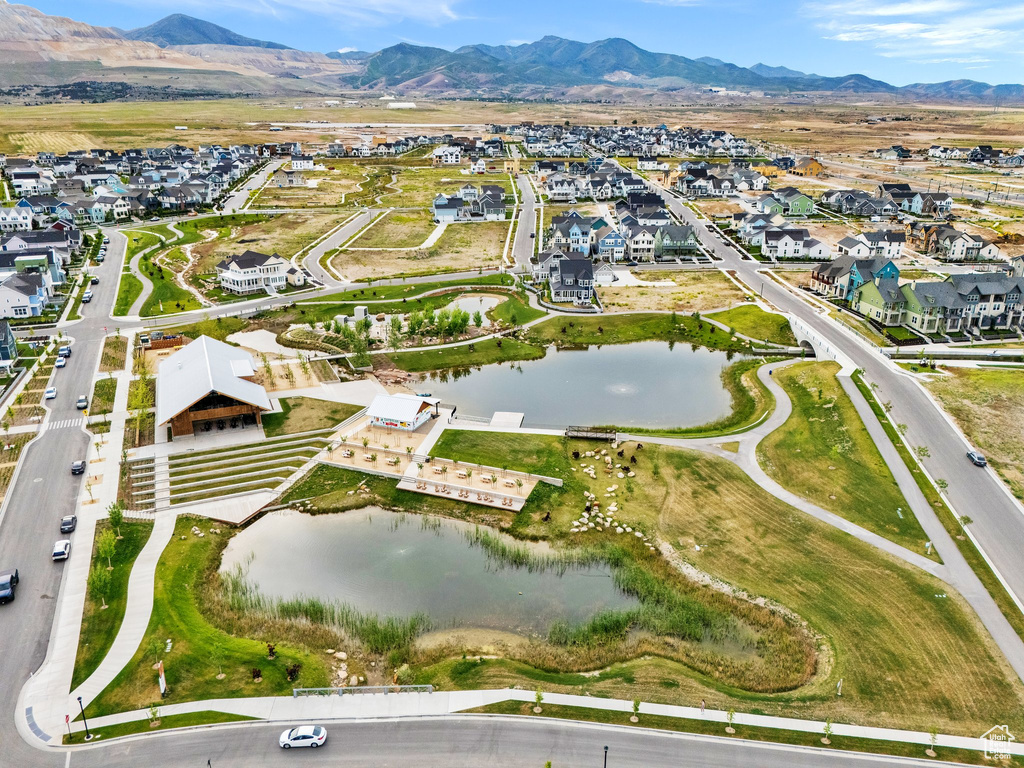 Aerial view of property\'s location featuring nearby suburban area and a water and mountain view