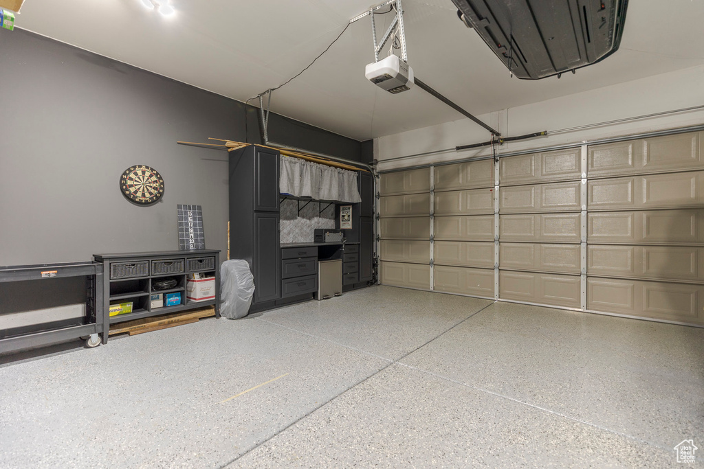 Garage featuring a garage door opener