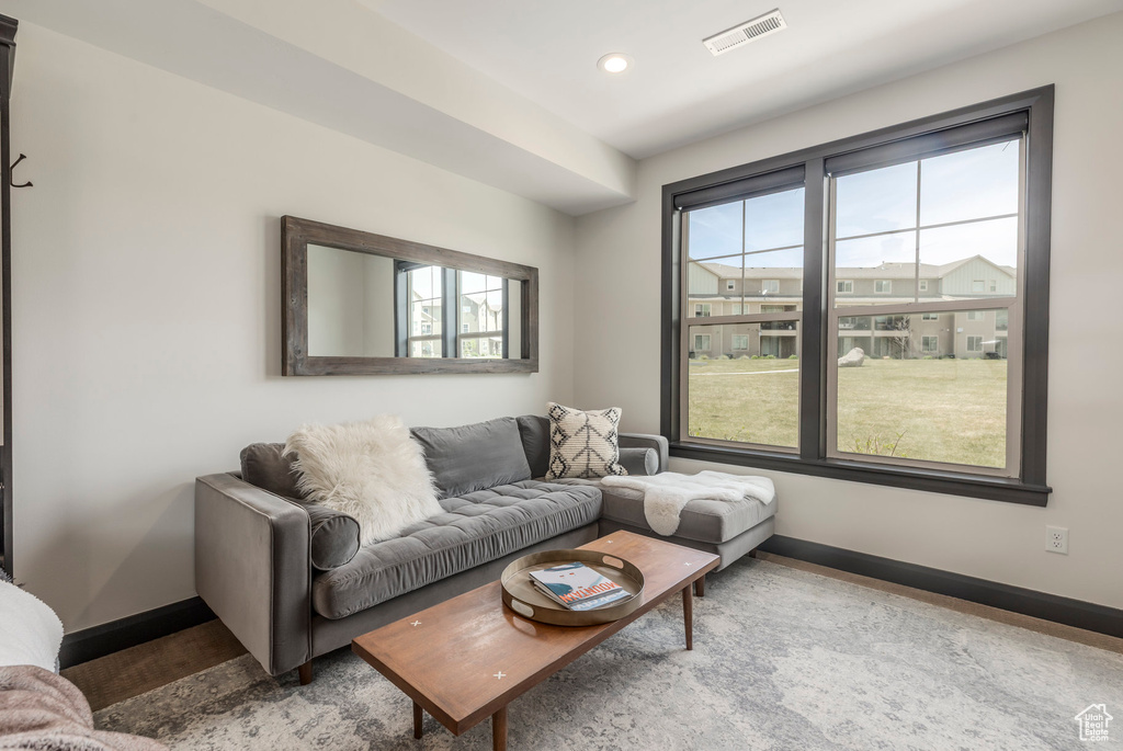 Living area with baseboards and recessed lighting