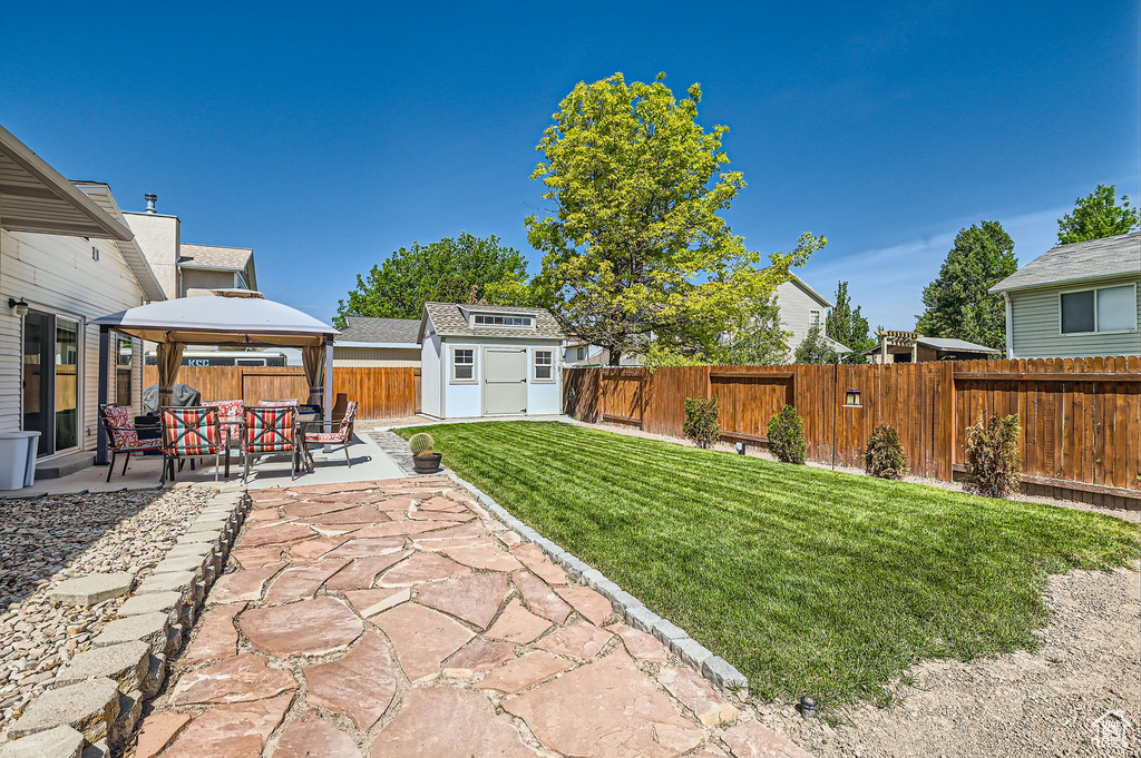 View of yard with a gazebo and a patio area