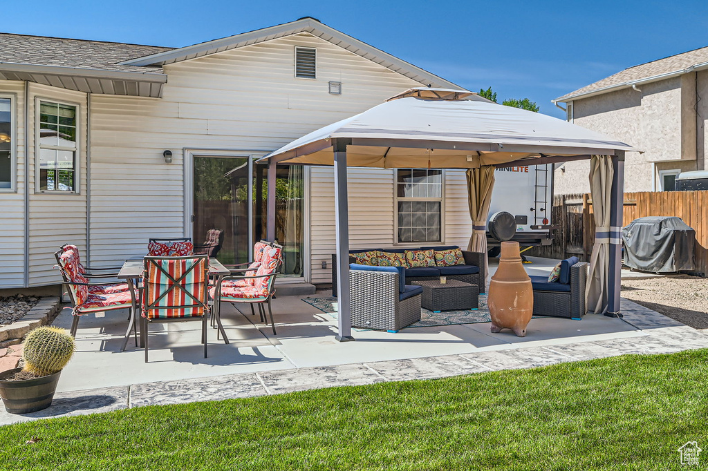 View of patio with an outdoor hangout area, a gazebo, and area for grilling