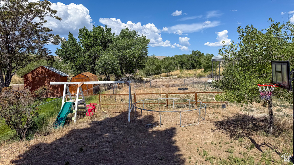 View of yard with a playground