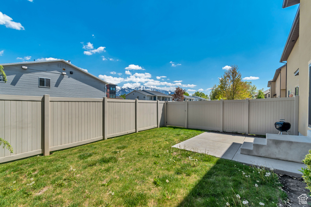 View of yard with a patio area
