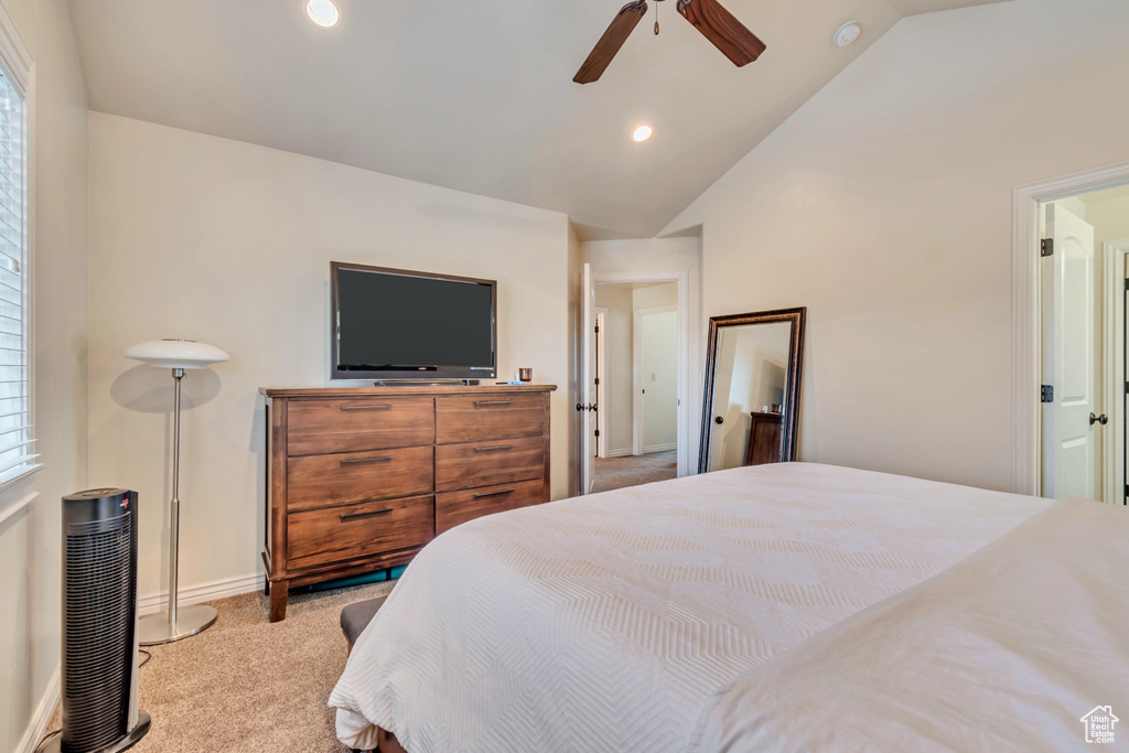 Bedroom with lofted ceiling, light colored carpet, recessed lighting, baseboards, and a ceiling fan