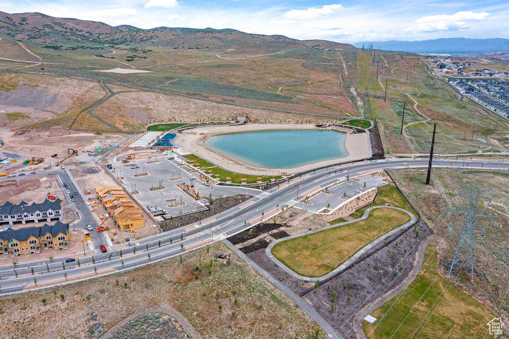 Aerial view of property and surrounding area with mountains