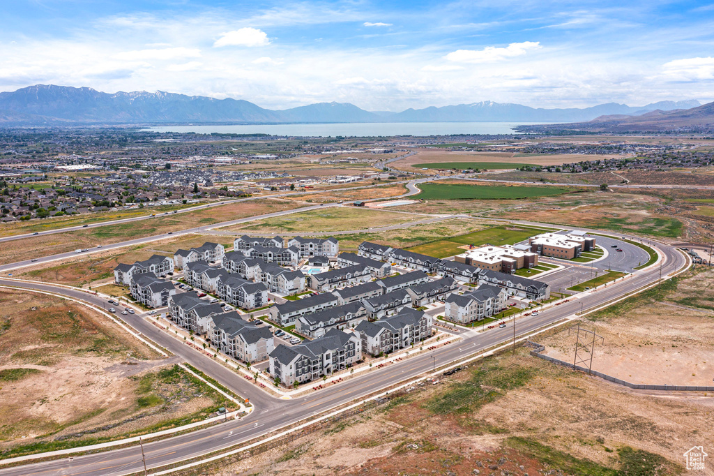 Aerial perspective of suburban area with a mountainous background